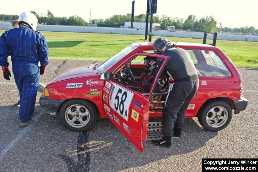 Team Festivus Ford Festiva in the pits.