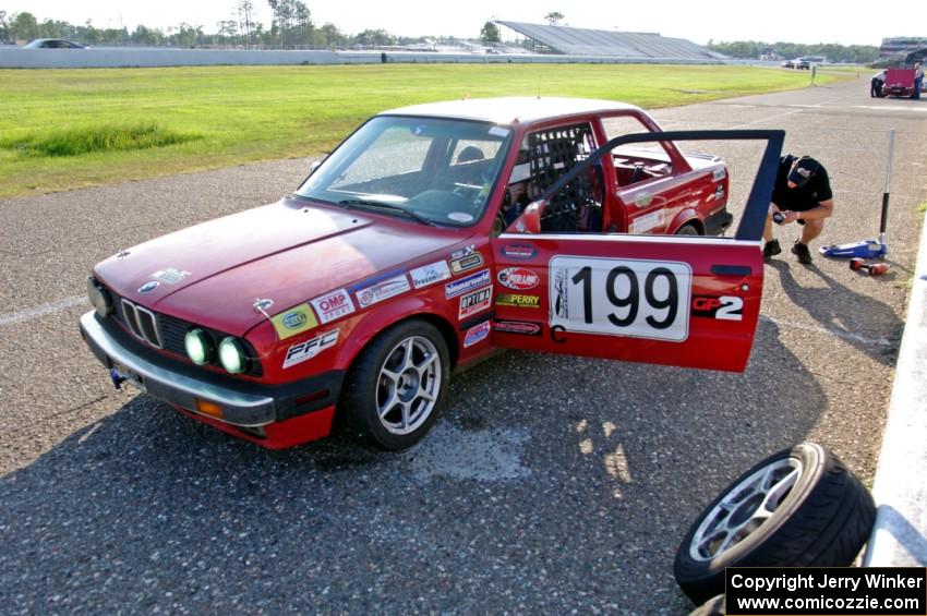 Cheap Shot Racing BMW 325is in the pits.