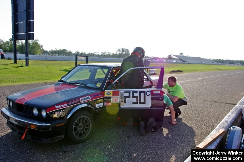 Locked Out Racing BMW 325is in the pits.