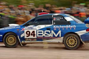 Piotr Fetela / John Hall Subaru Impreza STi comes through the SS1 (Green Acres I) spectator area.