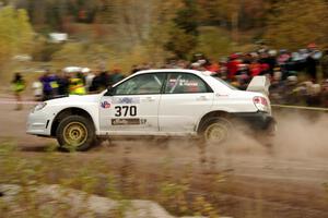 Garry Gill / Steve Harrell Subaru WRX comes through the SS1 (Green Acres I) spectator area.