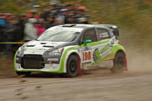 Arkadiusz Gruszka / Lukasz Wronski Mitsubishi Mirage RS comes through the SS1 (Green Acres I) spectator area.