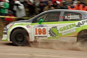 Arkadiusz Gruszka / Lukasz Wronski Mitsubishi Mirage RS comes through the SS1 (Green Acres I) spectator area.