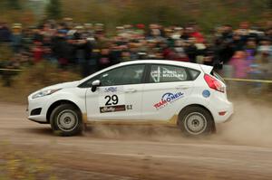 Tim O'Neil / Ian Williams Ford Fiesta R2 comes through the SS1 (Green Acres I) spectator area.