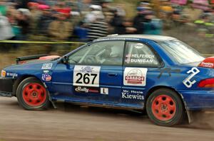 Dylan Helferich / Drake Dunigan Subaru Impreza comes through the SS1 (Green Acres I) spectator area.