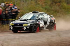 Corey Holmes / Dustin Masters Subaru Impreza comes through the SS1 (Green Acres I) spectator area.