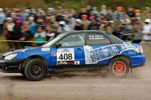 Mitchell Kelly / Weston Bailey Subaru Impreza comes through the SS1 (Green Acres I) spectator area.