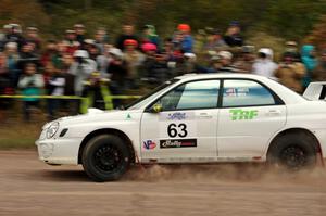 Reid Andress / Neil Moser Subaru WRX comes through the SS1 (Green Acres I) spectator area.