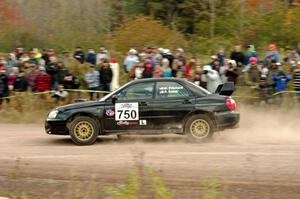 Meredith Pritchard / Rachelle Kaltak Subaru Impreza comes through the SS1 (Green Acres I) spectator area.