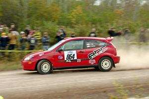 Erik Hill / Erica Meier Ford Focus comes through the SS1 (Green Acres I) spectator area.