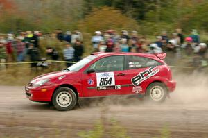 Erik Hill / Erica Meier Ford Focus comes through the SS1 (Green Acres I) spectator area.