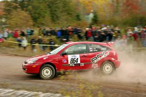 Erik Hill / Erica Meier Ford Focus comes through the SS1 (Green Acres I) spectator area.