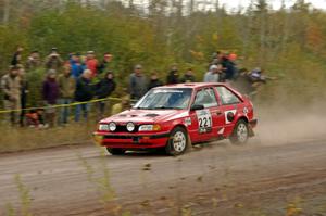 Jimmy Pelizzari / Sara Stevens Mazda 323GTX comes through the SS1 (Green Acres I) spectator area.