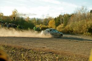 Tom Nelson's Subaru WRX, Car '0', comes through the SS15 (Green Acres II) spectator area.