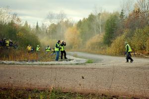 Photographer Arthur Partyka walks across the road after getting pummeled with gravel at the SS15 (Green Acres II) spectator area