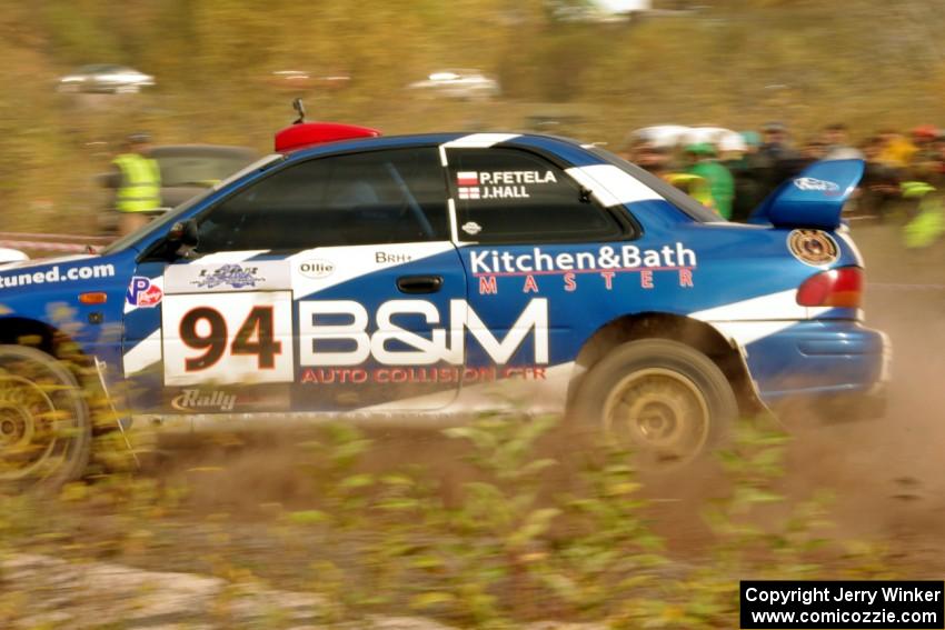 Piotr Fetela / John Hall Subaru Impreza STi comes through the SS1 (Green Acres I) spectator area.