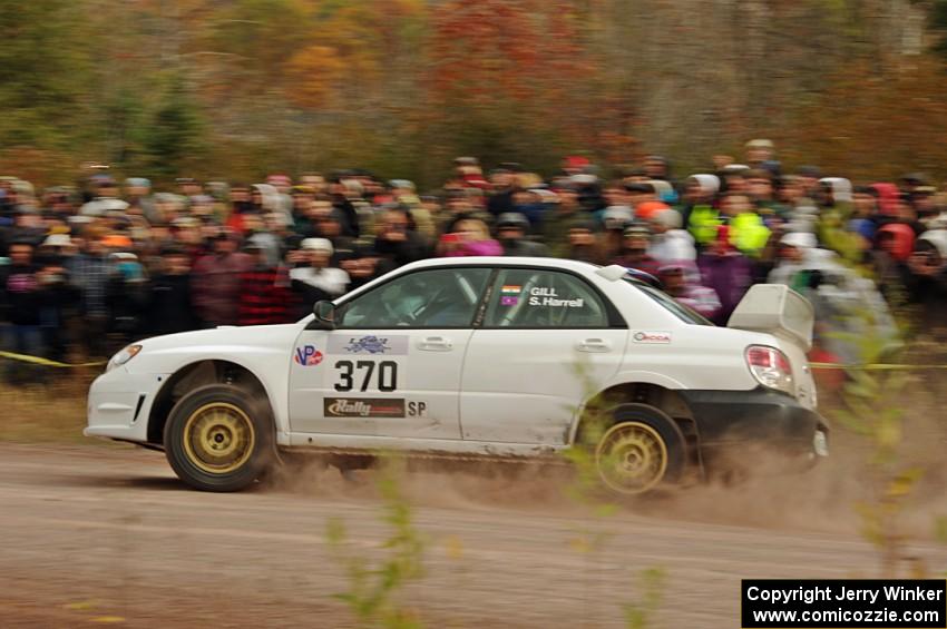 Garry Gill / Steve Harrell Subaru WRX comes through the SS1 (Green Acres I) spectator area.