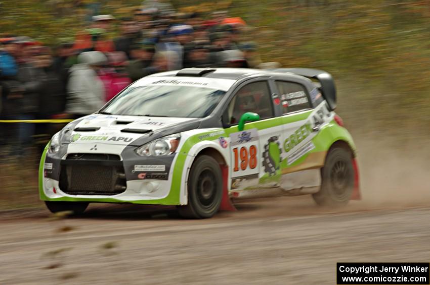 Arkadiusz Gruszka / Lukasz Wronski Mitsubishi Mirage RS comes through the SS1 (Green Acres I) spectator area.