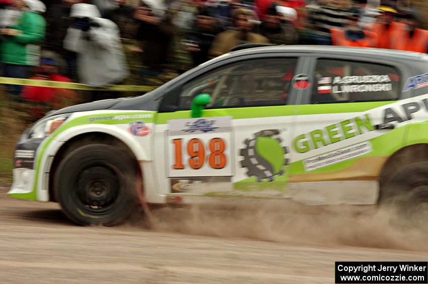 Arkadiusz Gruszka / Lukasz Wronski Mitsubishi Mirage RS comes through the SS1 (Green Acres I) spectator area.