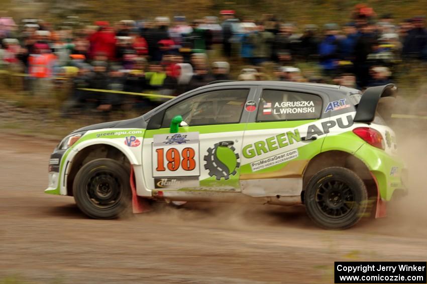 Arkadiusz Gruszka / Lukasz Wronski Mitsubishi Mirage RS comes through the SS1 (Green Acres I) spectator area.