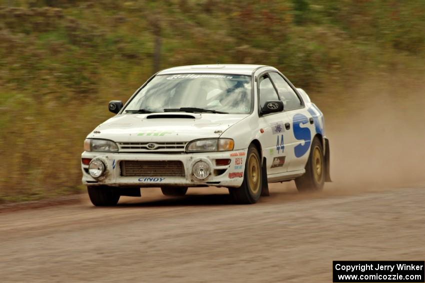 Henry Krolikowski / Cindy Krolikowski Subaru Impreza comes through the SS1 (Green Acres I) spectator area.