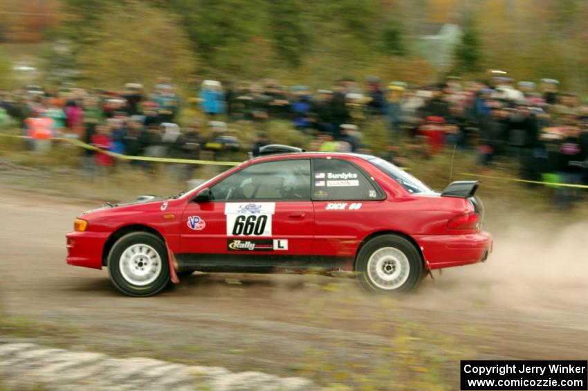 Chuck Surdyke / Colin Vickman Subaru Impreza comes through the SS1 (Green Acres I) spectator area.