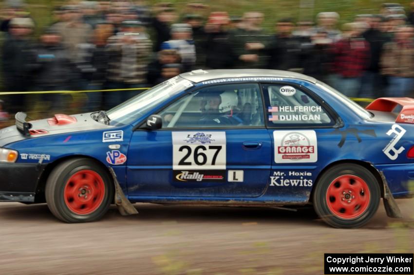 Dylan Helferich / Drake Dunigan Subaru Impreza comes through the SS1 (Green Acres I) spectator area.