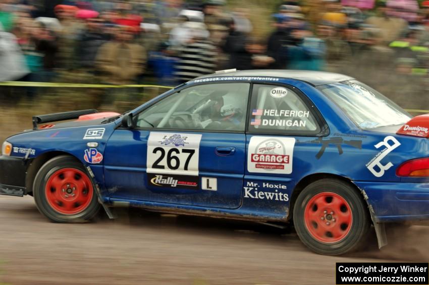 Dylan Helferich / Drake Dunigan Subaru Impreza comes through the SS1 (Green Acres I) spectator area.