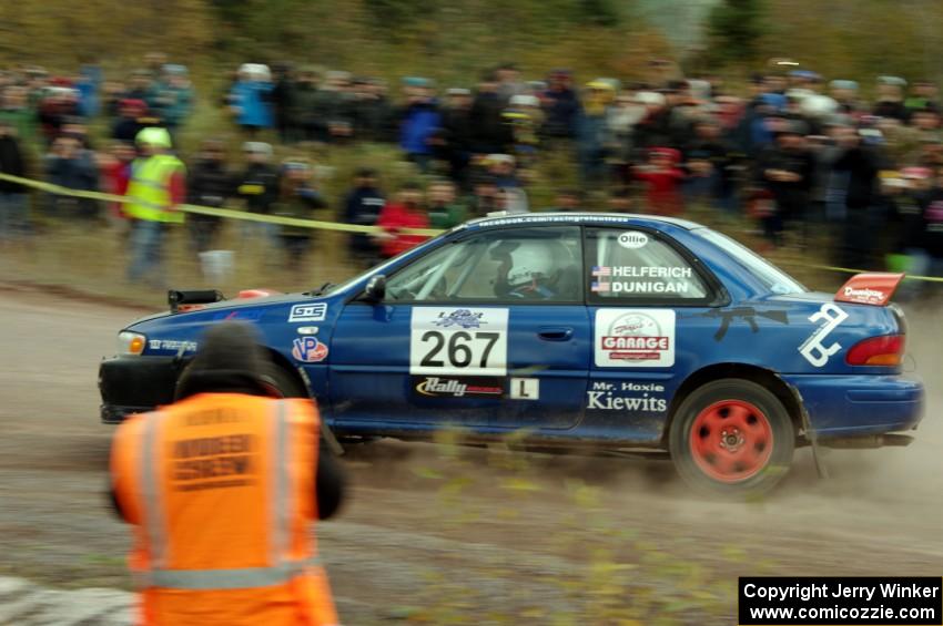 Dylan Helferich / Drake Dunigan Subaru Impreza comes through the SS1 (Green Acres I) spectator area.