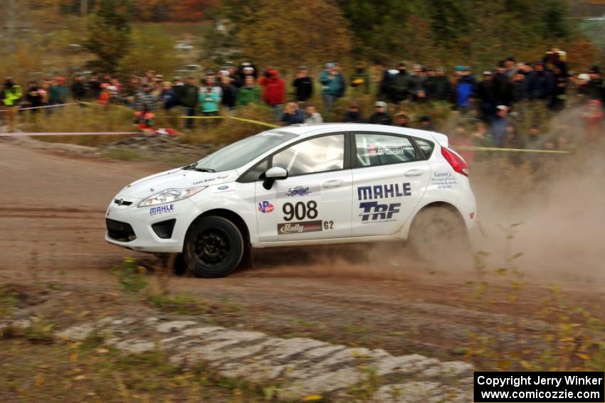 Justin Kollien / Daniel Garant Ford Fiesta R1 comes through the SS1 (Green Acres I) spectator area.