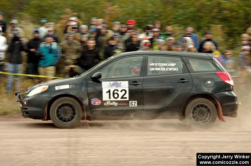 Kyle Steinkamp / Spencer Wasilewski Toyota Matrix comes through the SS1 (Green Acres I) spectator area.