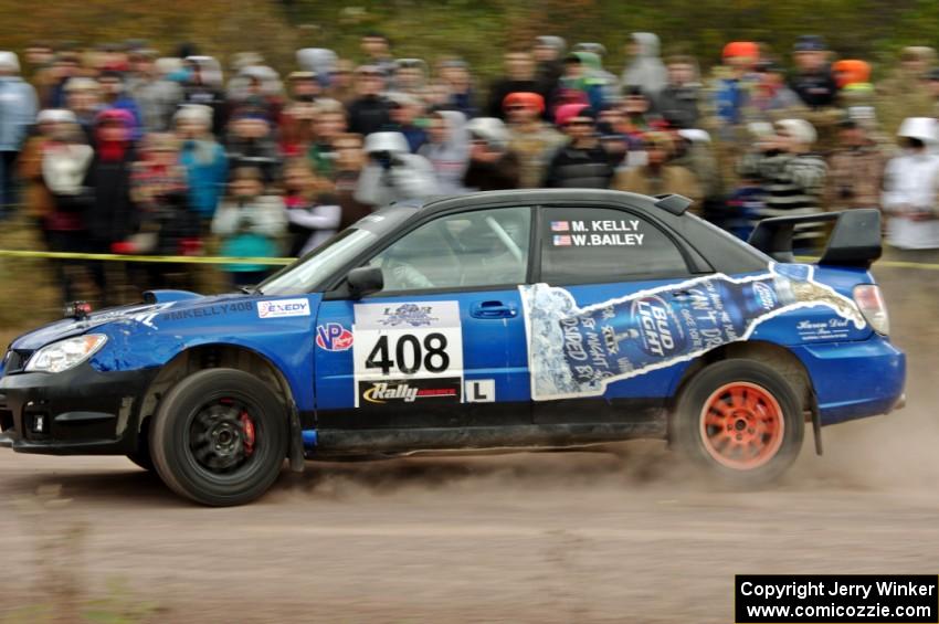 Mitchell Kelly / Weston Bailey Subaru Impreza comes through the SS1 (Green Acres I) spectator area.