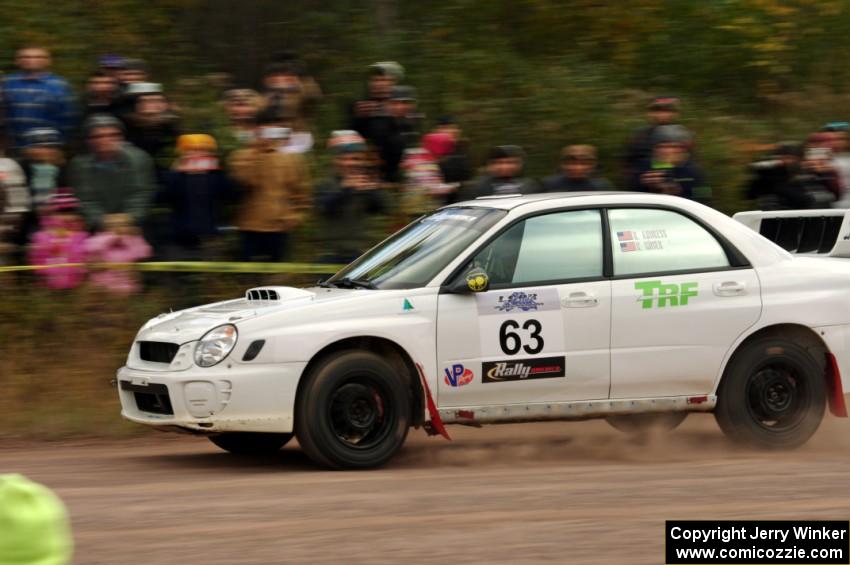 Reid Andress / Neil Moser Subaru WRX comes through the SS1 (Green Acres I) spectator area.