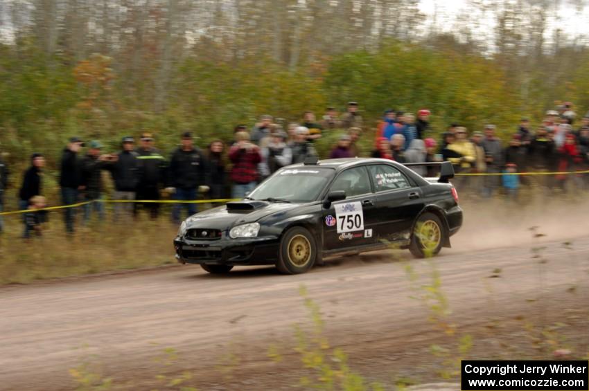 Meredith Pritchard / Rachelle Kaltak Subaru Impreza comes through the SS1 (Green Acres I) spectator area.