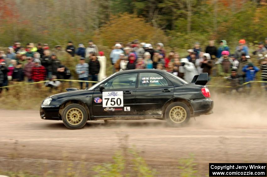 Meredith Pritchard / Rachelle Kaltak Subaru Impreza comes through the SS1 (Green Acres I) spectator area.