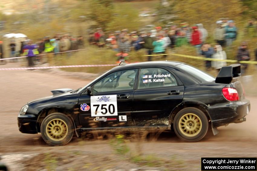 Meredith Pritchard / Rachelle Kaltak Subaru Impreza comes through the SS1 (Green Acres I) spectator area.