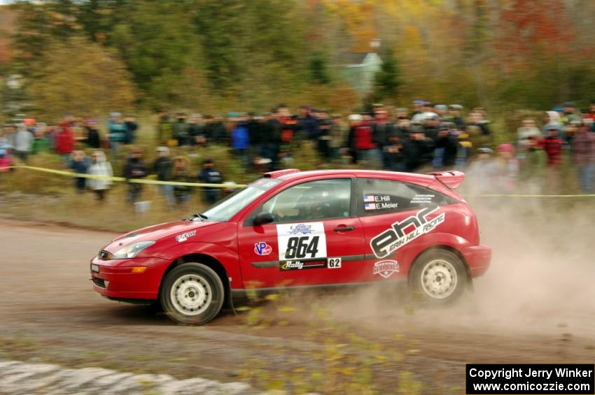 Erik Hill / Erica Meier Ford Focus comes through the SS1 (Green Acres I) spectator area.