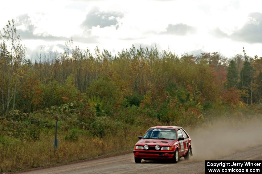 Jimmy Pelizzari / Kate Stevens Mazda 323GTX comes through the SS1 (Green Acres I) spectator area.