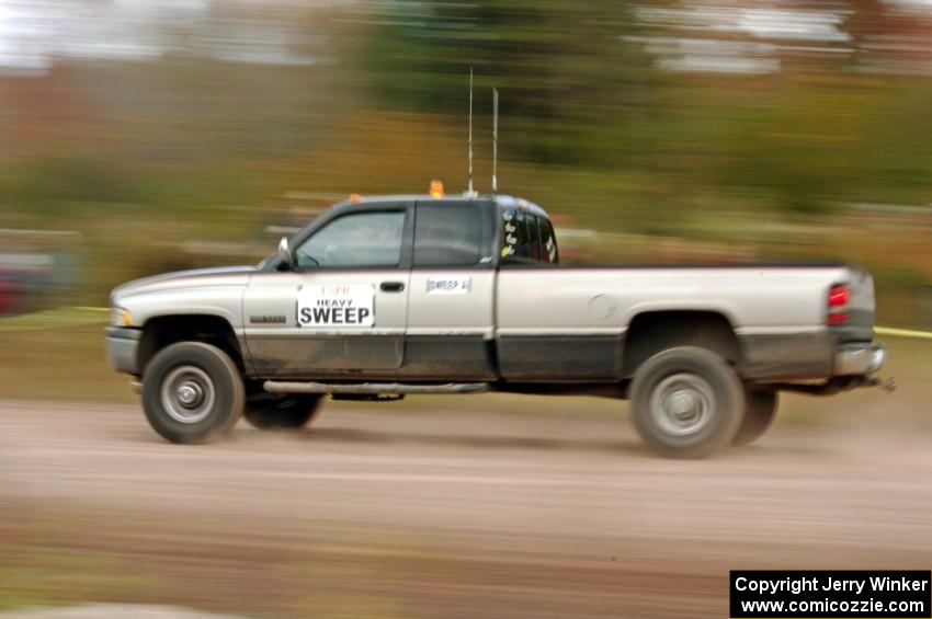 A heavy sweep truck comes through the SS1 (Green Acres I) spectator area.