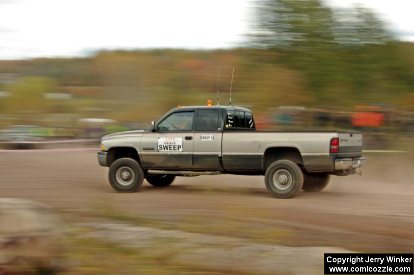 A heavy sweep truck comes through the SS1 (Green Acres I) spectator area.