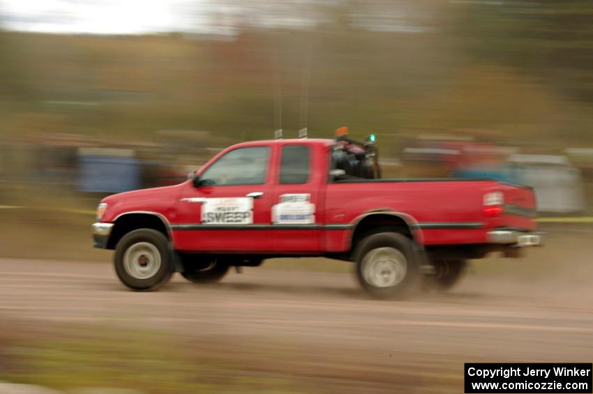 A heavy sweep truck comes through the SS1 (Green Acres I) spectator area.