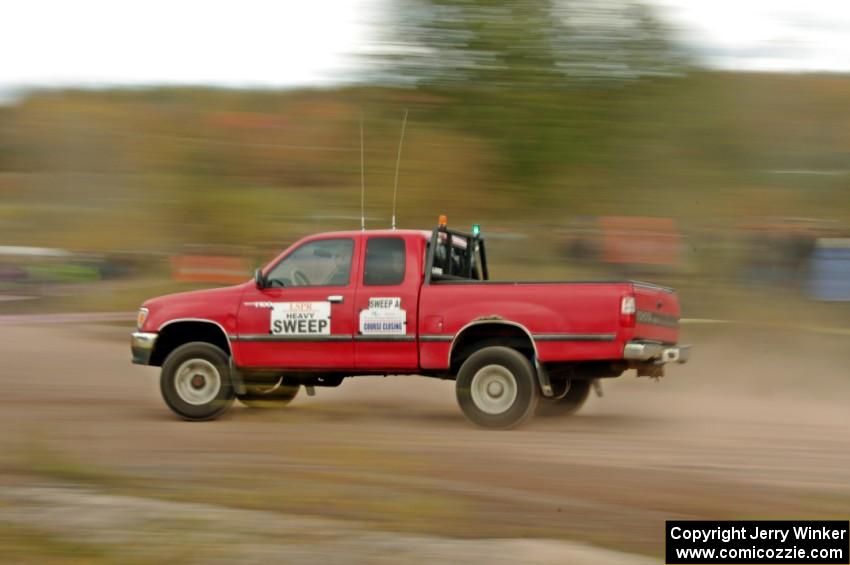 A heavy sweep truck comes through the SS1 (Green Acres I) spectator area.