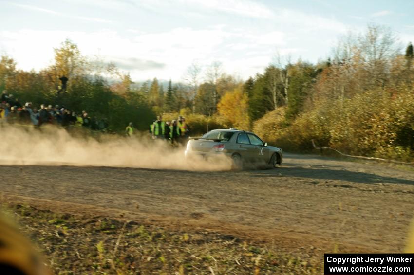 Tom Nelson's Subaru WRX, Car '0', comes through the SS15 (Green Acres II) spectator area.