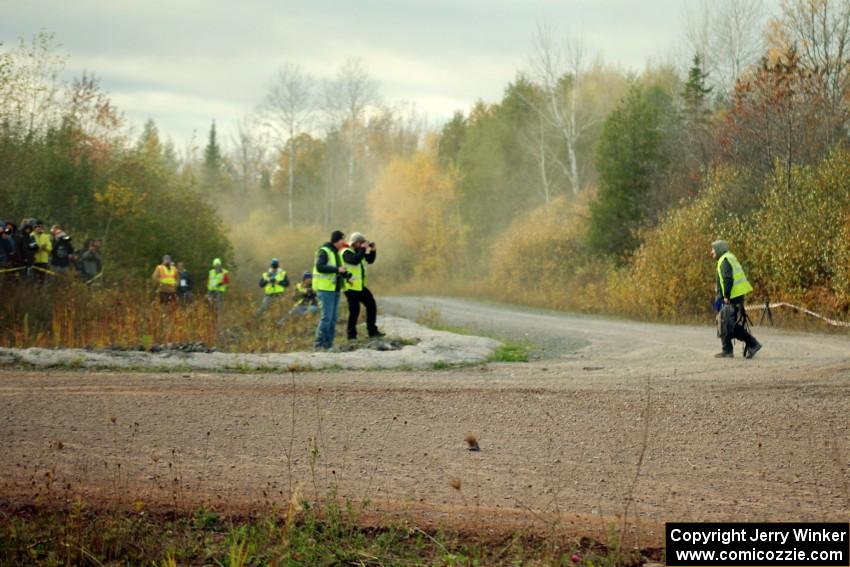 Photographer Arthur Partyka walks across the road after getting pummeled with gravel at the SS15 (Green Acres II) spectator area