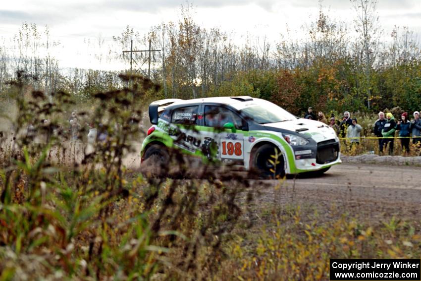 Arkadiusz Gruszka / Lukasz Wronski Mitsubishi Mirage RS comes through the SS15 (Green Acres II) spectator area.