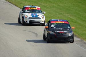 James Wilson's Mazda 2 and P.J. Groenke's MINI Cooper