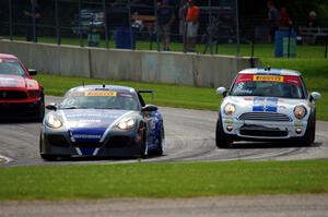 John Weisberg's Porsche Cayman and P.J. Groenke's MINI Cooper