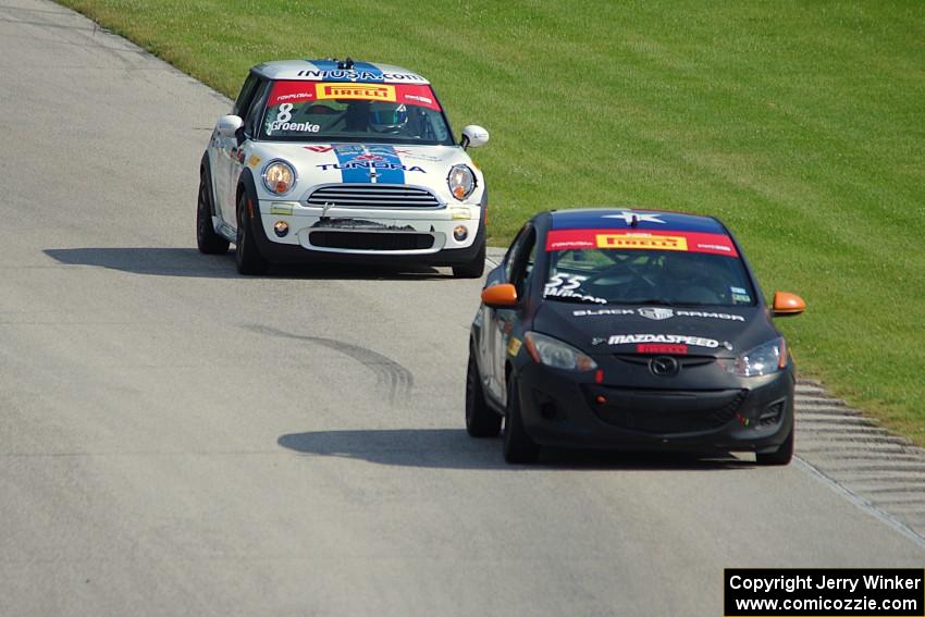 James Wilson's Mazda 2 and P.J. Groenke's MINI Cooper