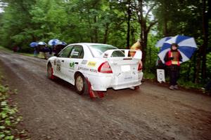 Tom Lawless / Brian Sharkey Mitubishi Lancer Evo IV at the start of the rainy Friday practice stage.