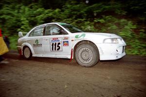 Seamus Burke / Frank Cunningham Mitsubishi Lancer Evo VI at the start of the rainy Friday practice stage.